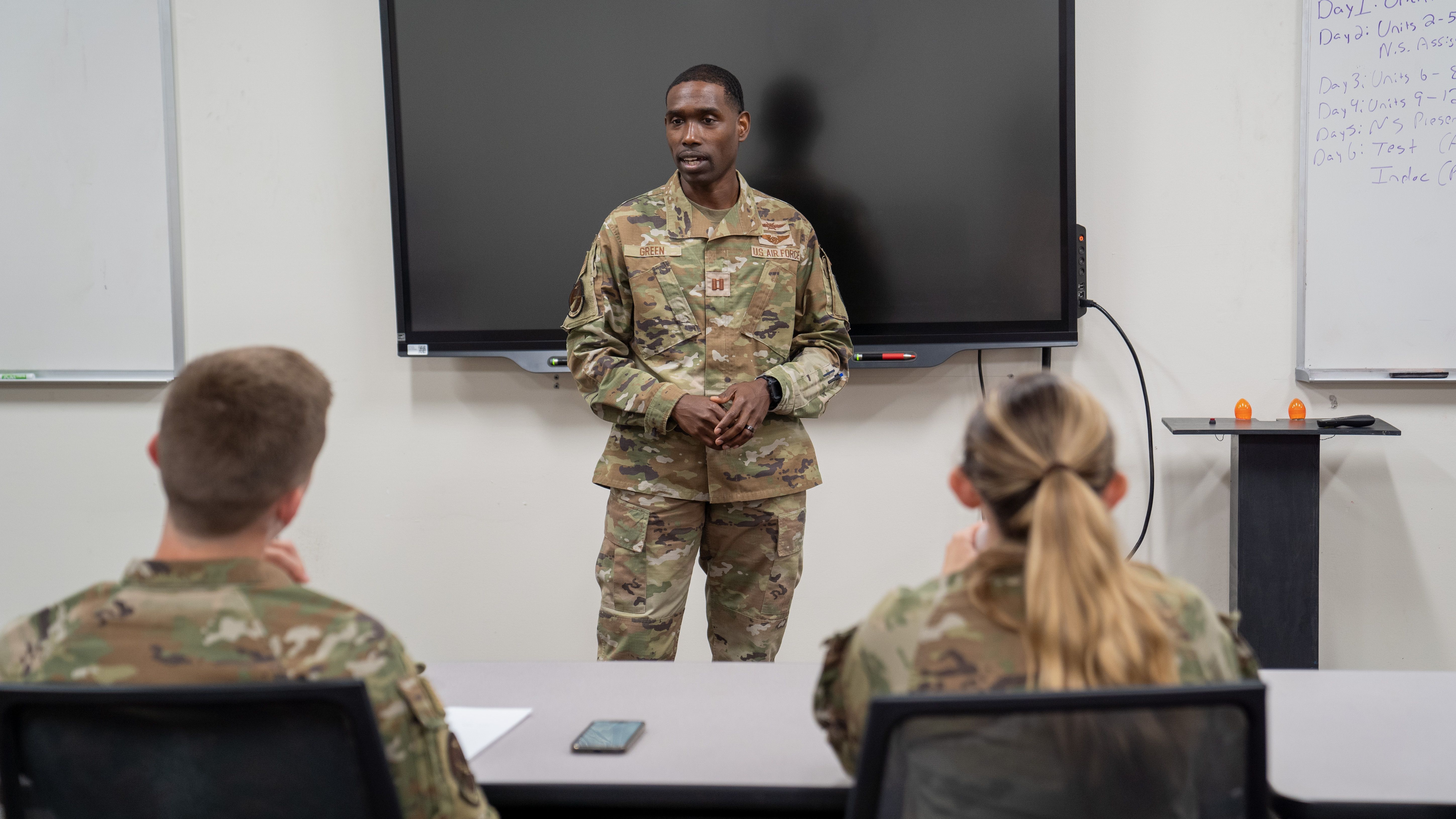 Instructor speaking to students in classroom